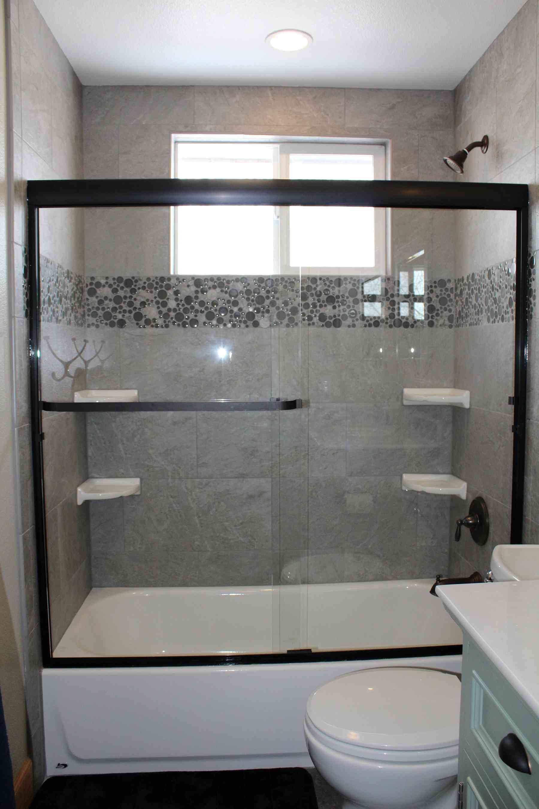 Beautiful new shower tile and sliding glass door!